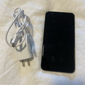 LG K30 Android phone with charger
